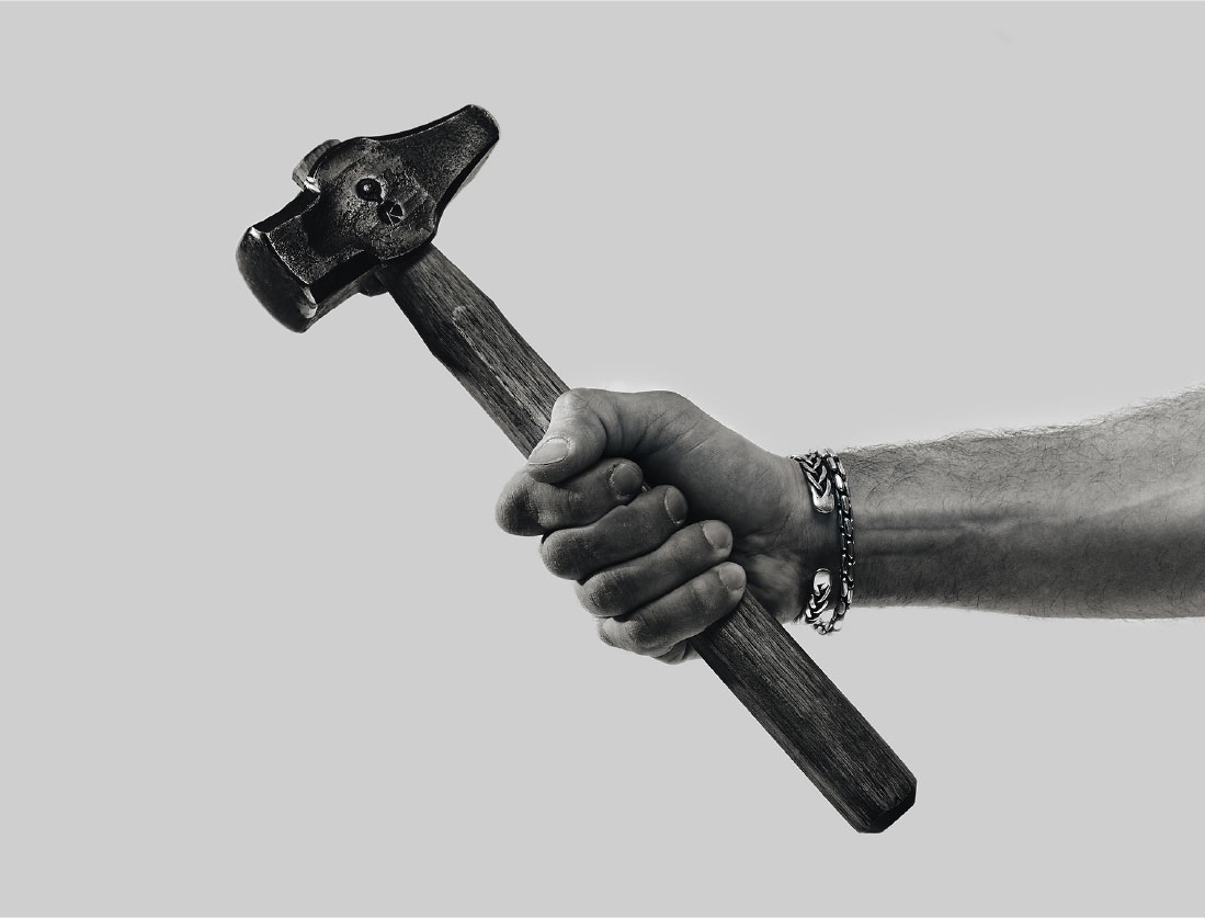 Living Steel 626 Founder Abe Shaw with forging hammer