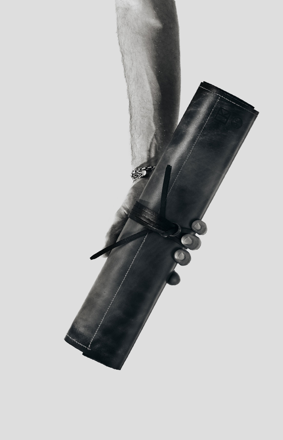 Living Steel 626 Founder Abe Shaw with leather knife storage wrap