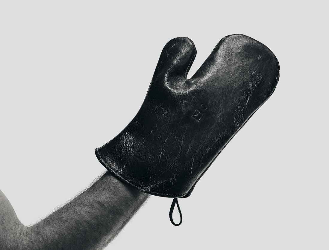 Living Steel 626 Founder Abe Shaw with leather oven mitts